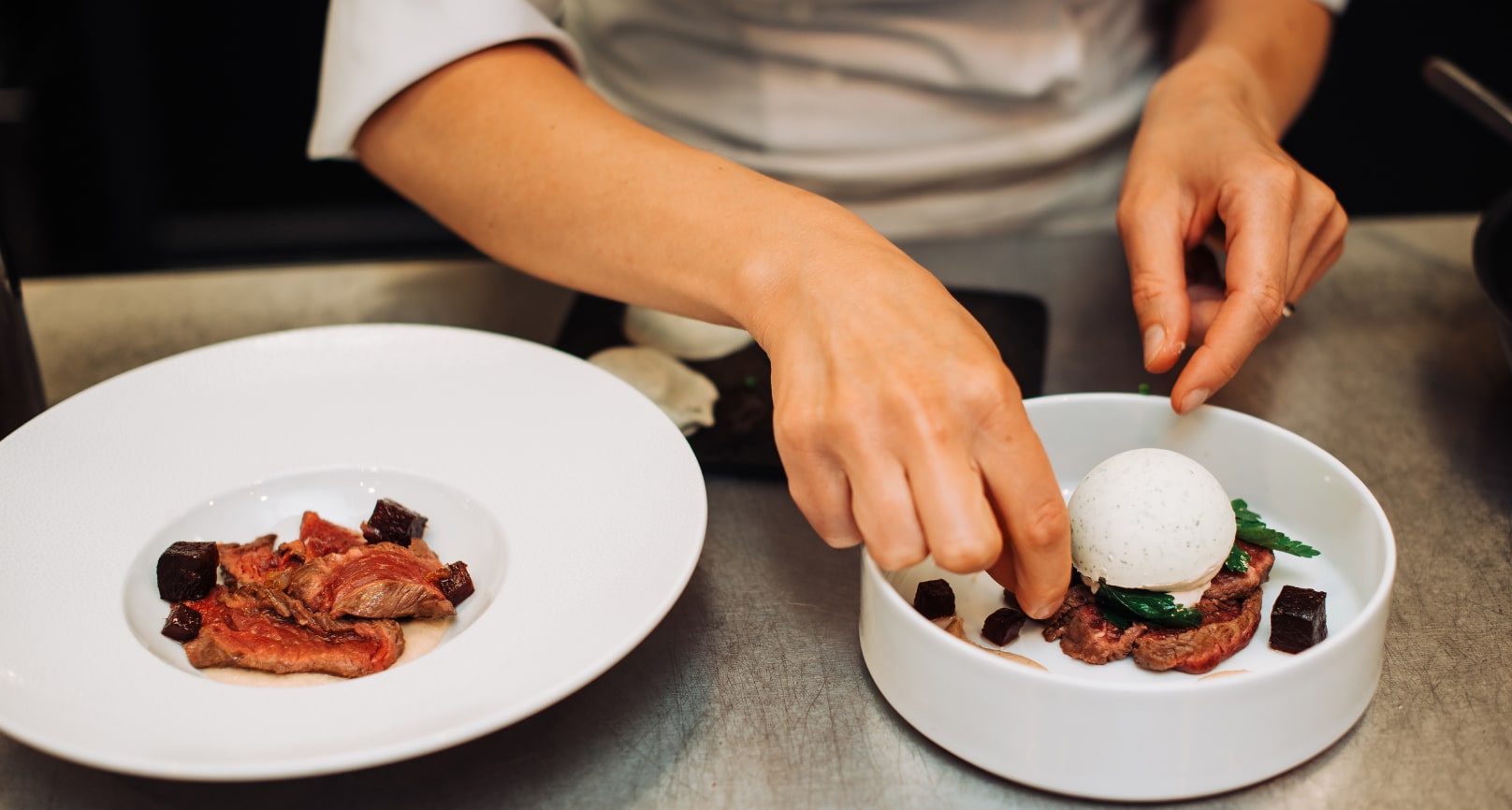 Chef preparing two dishes